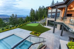 photo of backyard with artificial turf and pool